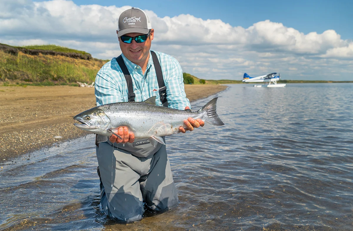 Holding a hen silver salmon caught in Alaska